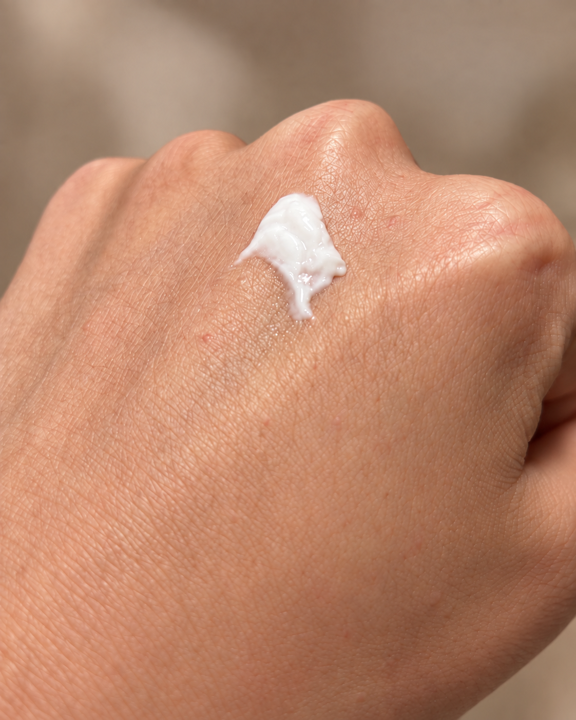 Daily Repair & Calm Moisturizer amount shown on hand