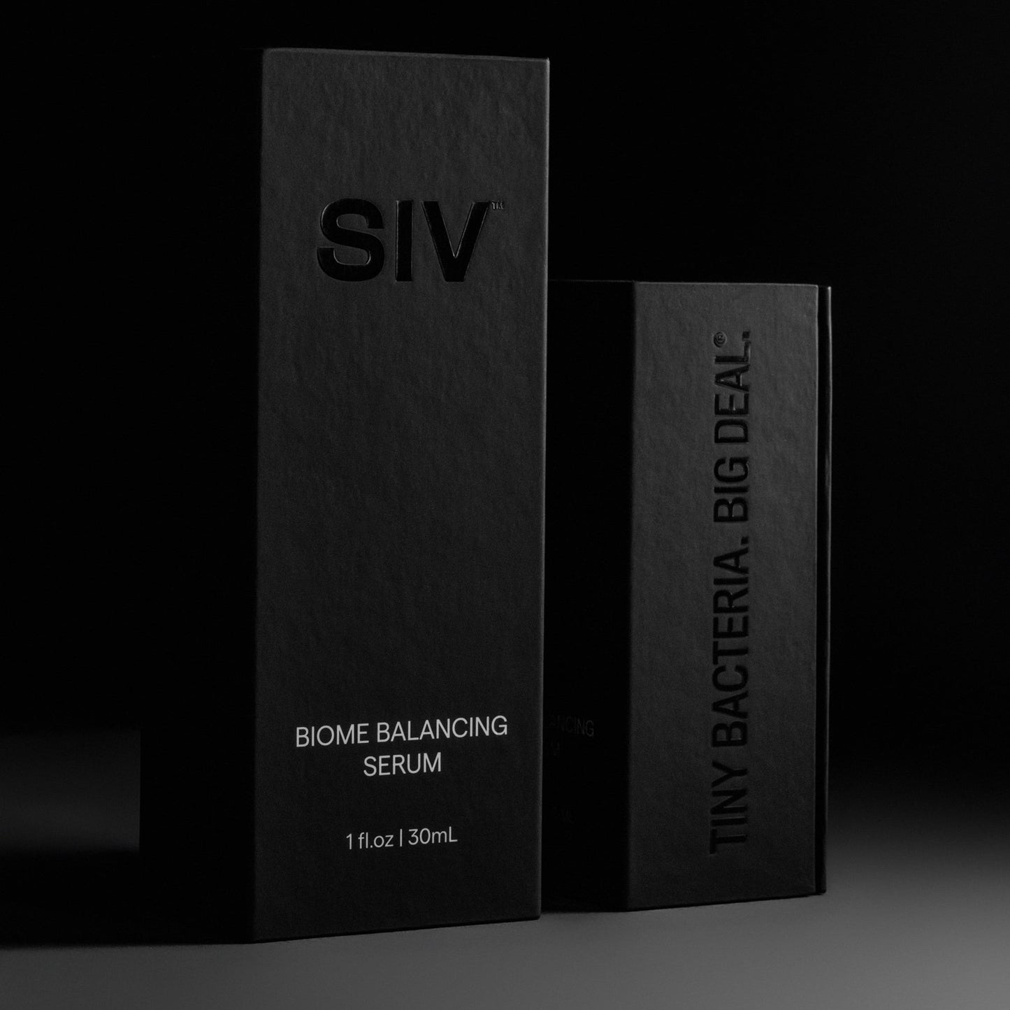 SIV Biome Balancing Serum bottles with black product boxes